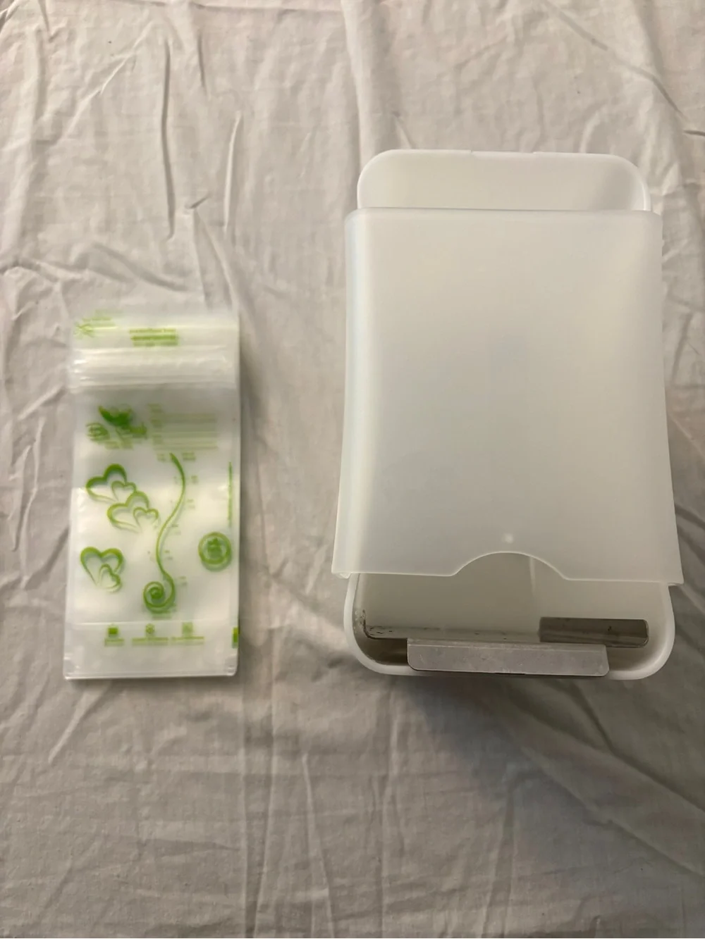 Breast milk freezer dispenser and bags